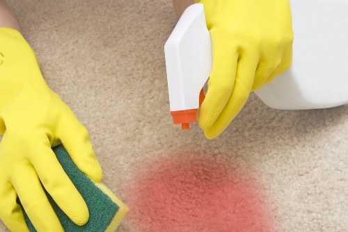 Inspector checking a cleaned carpet for service concerns